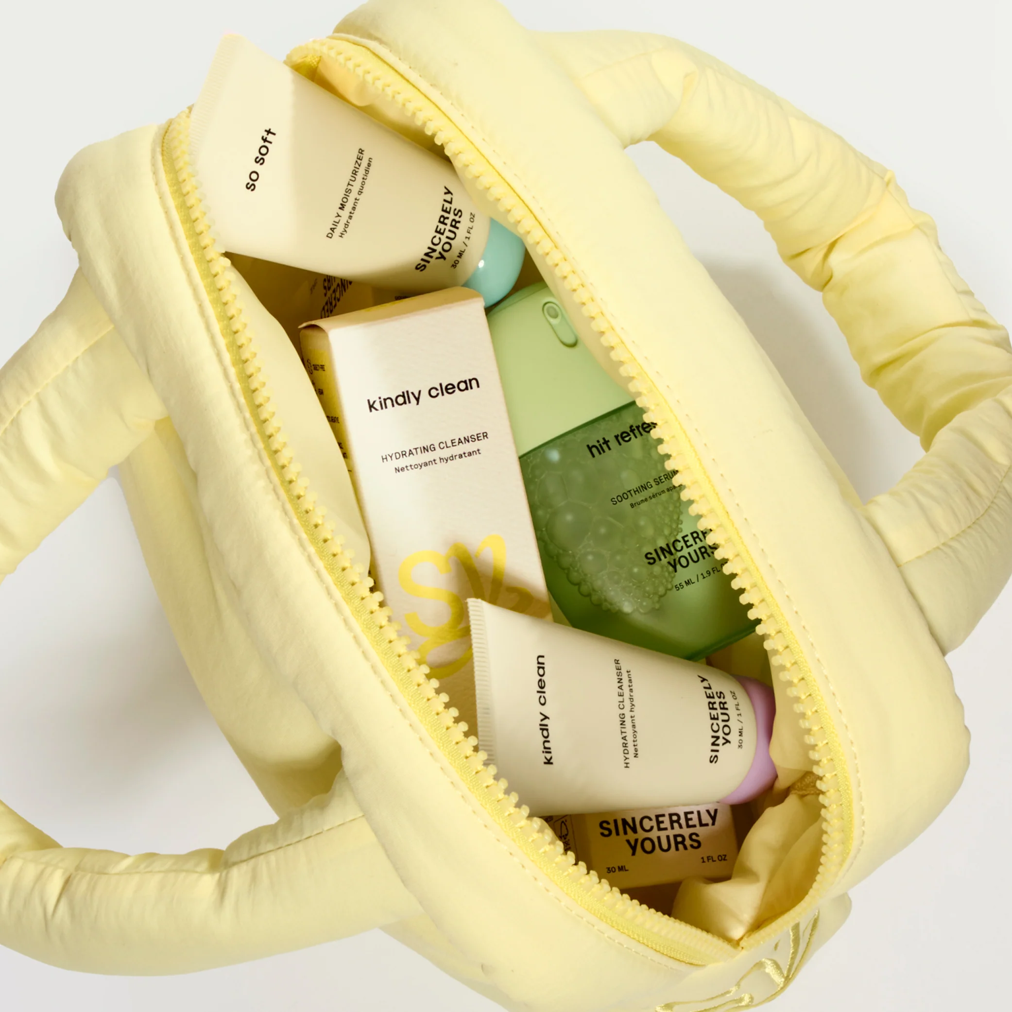 A yellow Sincerely Yours pouch packed with skincare products