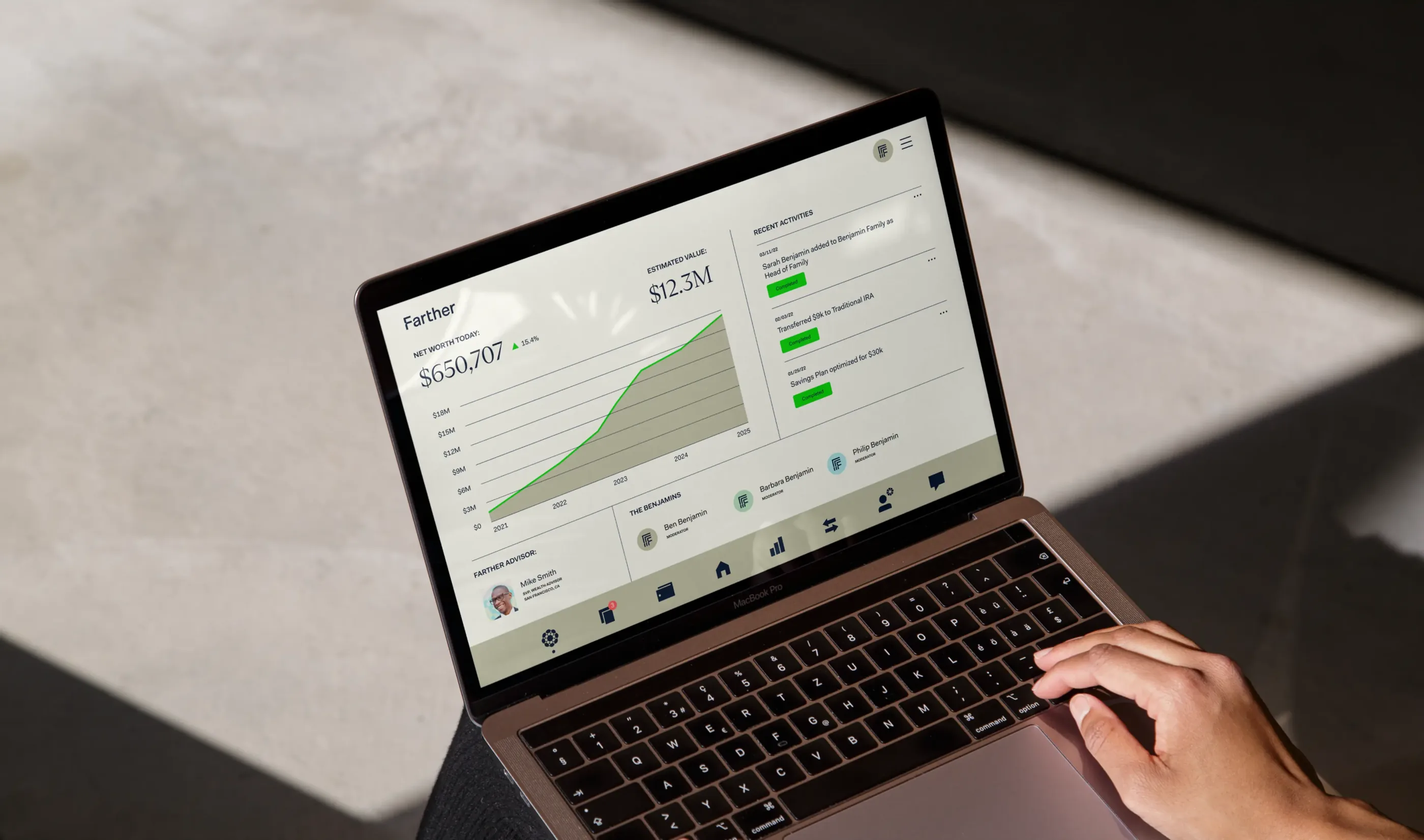The Farther wealth dashboard open on a laptop